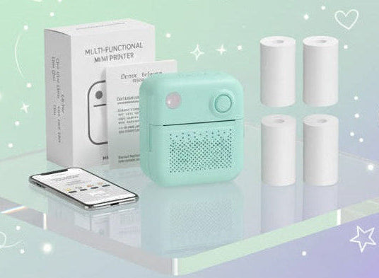 Mini printer with thermal paper on a transparent platform against a gradient background